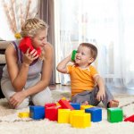 mother and baby playing with blocks